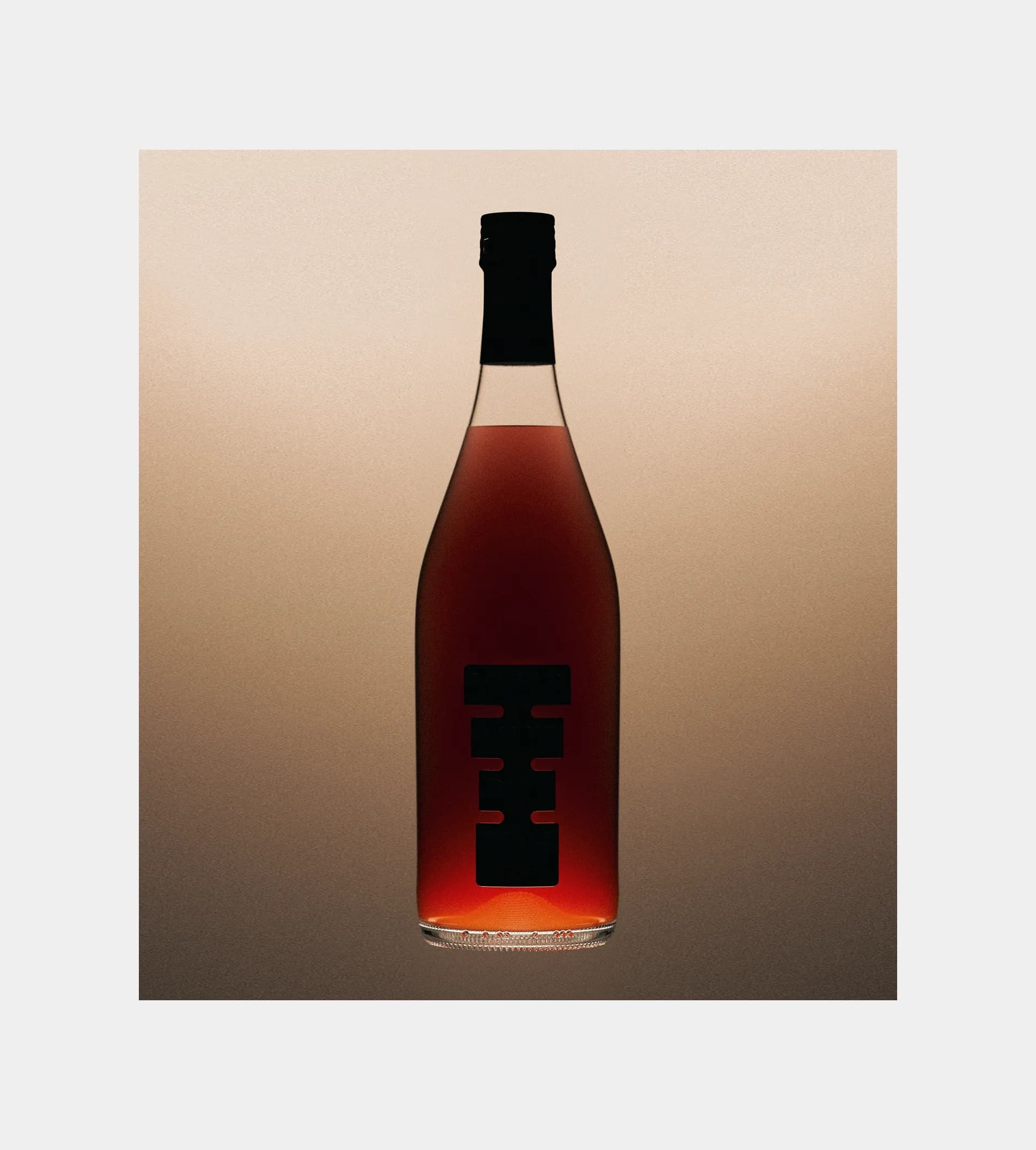 Full Shwung bottle shot against a warm brown background, showing the die-cut label with the typographic system visible through the dark red glass.