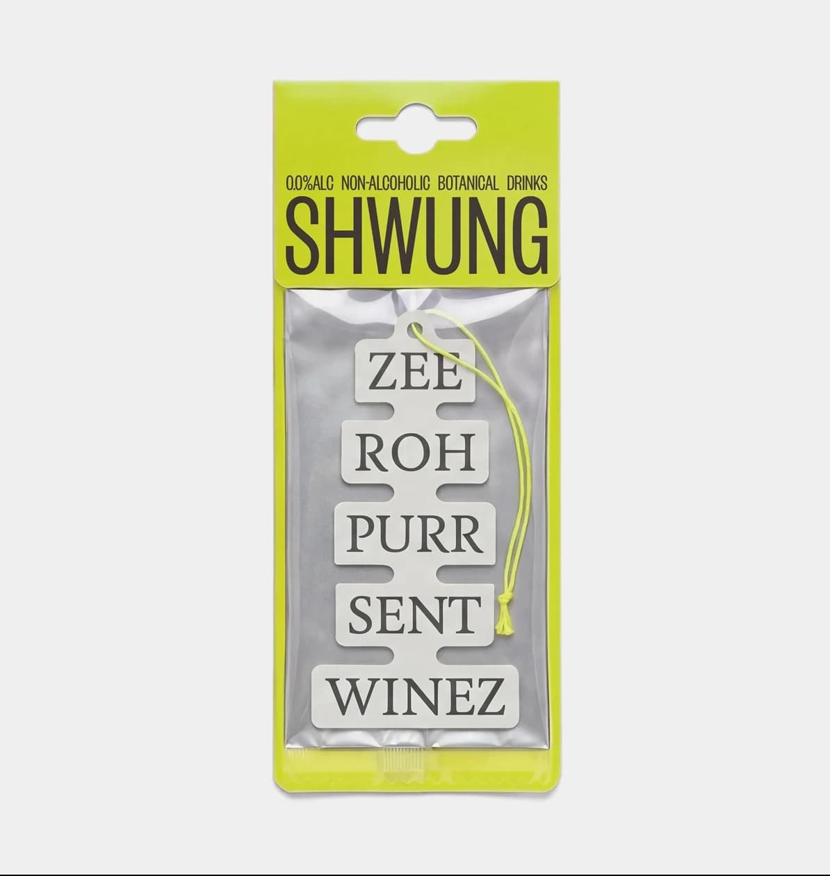 Shwung branded car air freshener in the die-cut label shape, packaged in yellow-green with the phonetic spelling "ZEE ROH PURR SENT WINEZ" stacked down the front.
