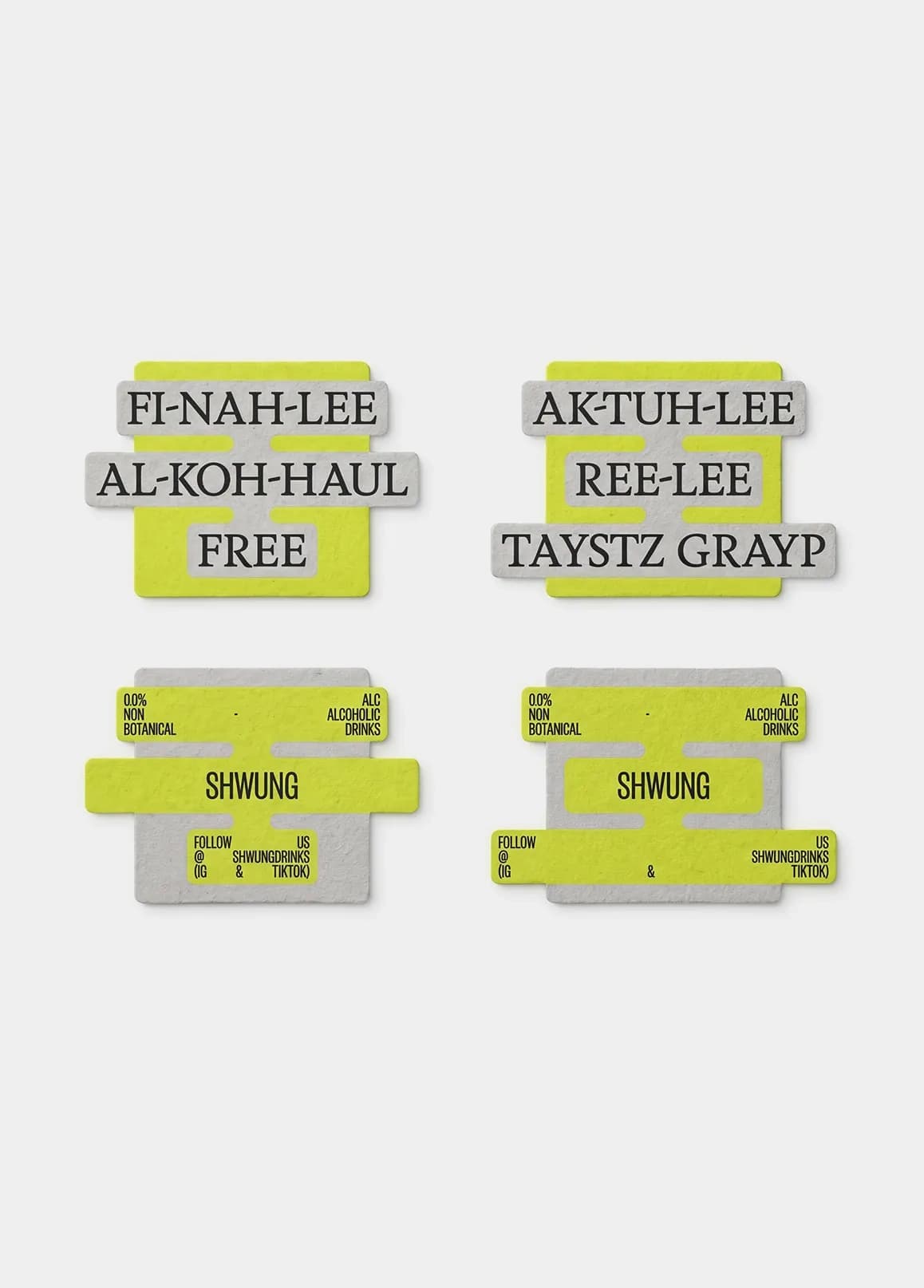 Six Shwung coasters in the die-cut label shape showing front and back, with phonetic punchlines on the front ("Fi-nah-lee al-koh-haul free", "Ak-tuh-lee ree-lee taystz grayp", "Noh reh-cov-er-ee nee-did") and the Shwung brand information on the grey and yellow-green reverse.
