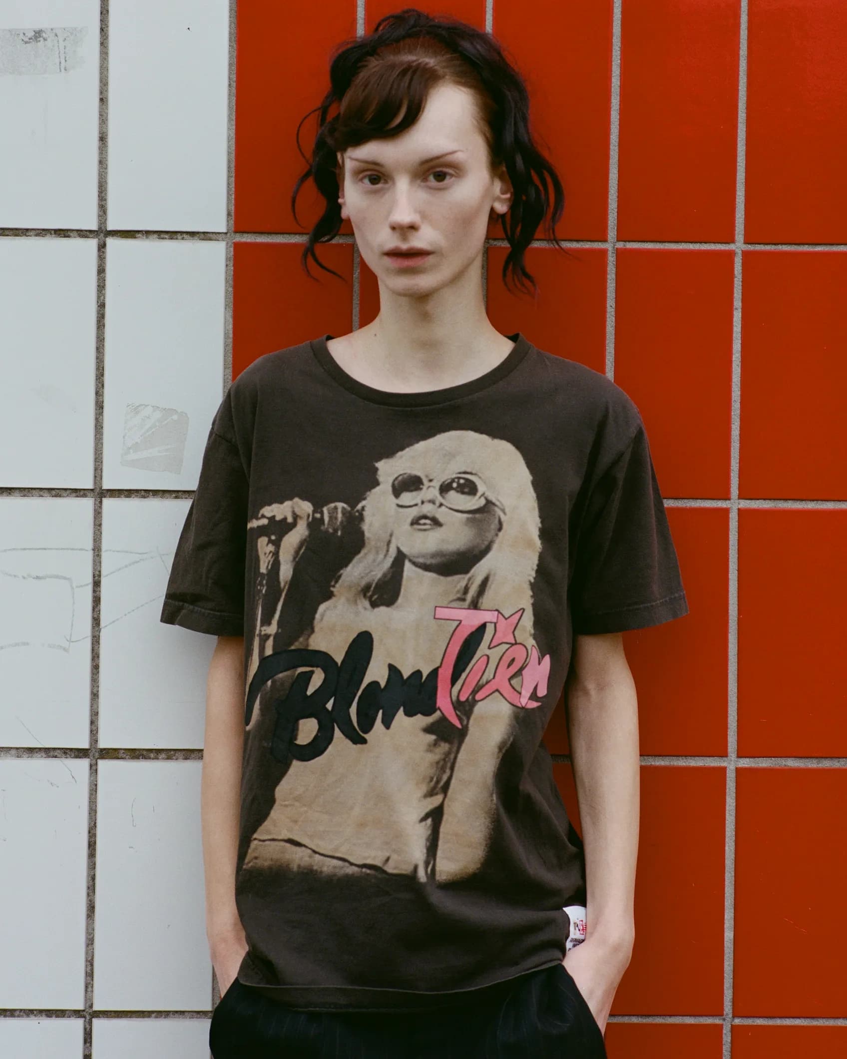 Close-up of a vintage Blondie band t-shirt with the band name replaced by TIEN in pink, keeping the original concert photo and script lettering style intact.