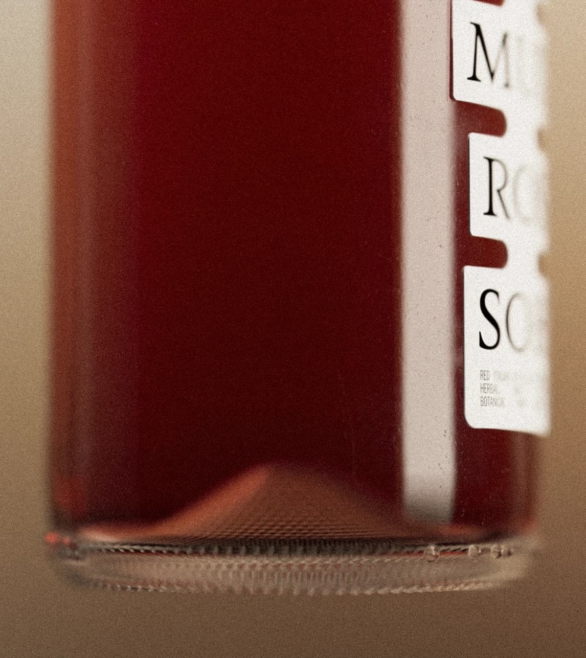Close-up detail of two Shwung bottle showing the label typography and sticker system.